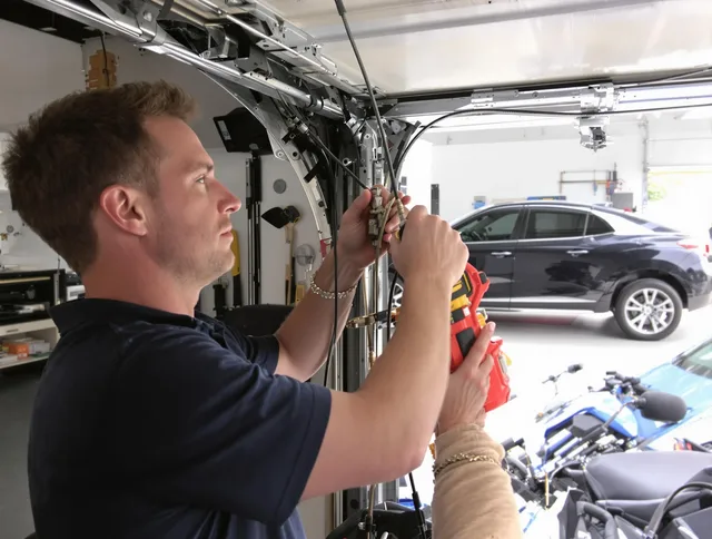 Hanson Garage Door Repair safety certified technician performing cable replacement in Hanson