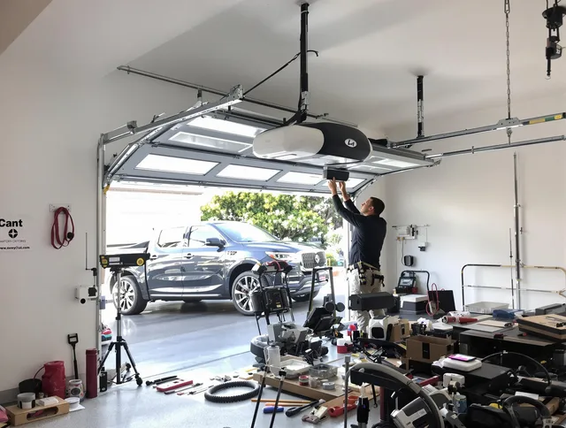 Hanson Garage Door Repair specialist installing smart garage door opener system in Hanson home