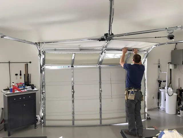 Hanson Garage Door Repair specialist performing precise section replacement on Hanson garage door